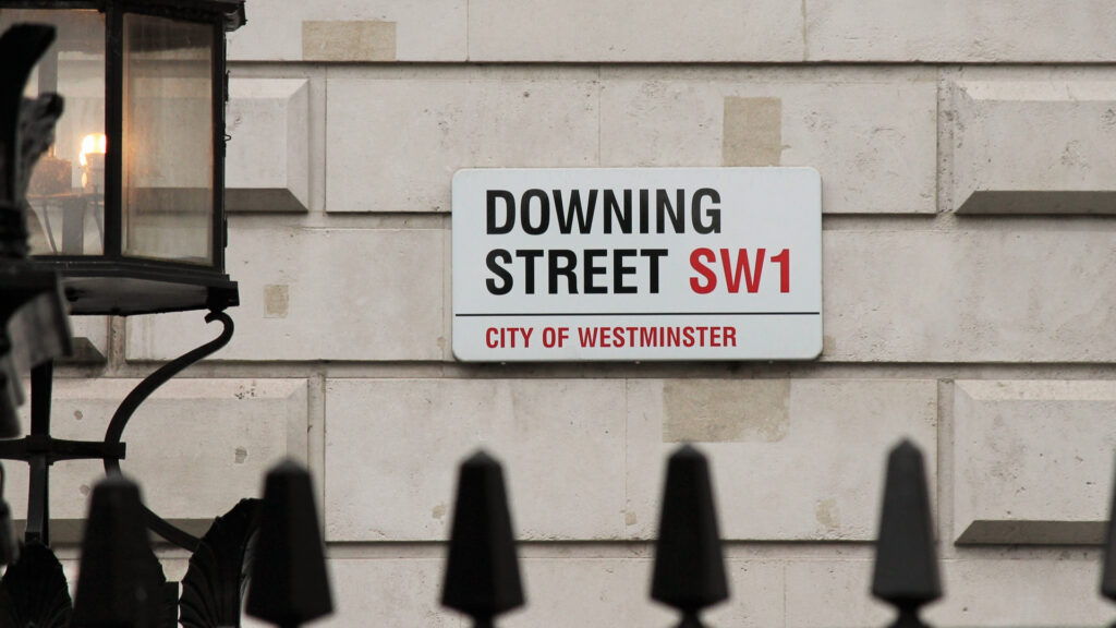 An image of the street sign of Downing Street, London