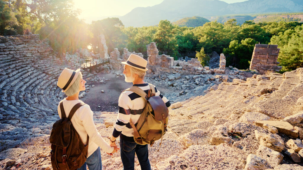 A mature couple visiting an ancient amphitheatre.