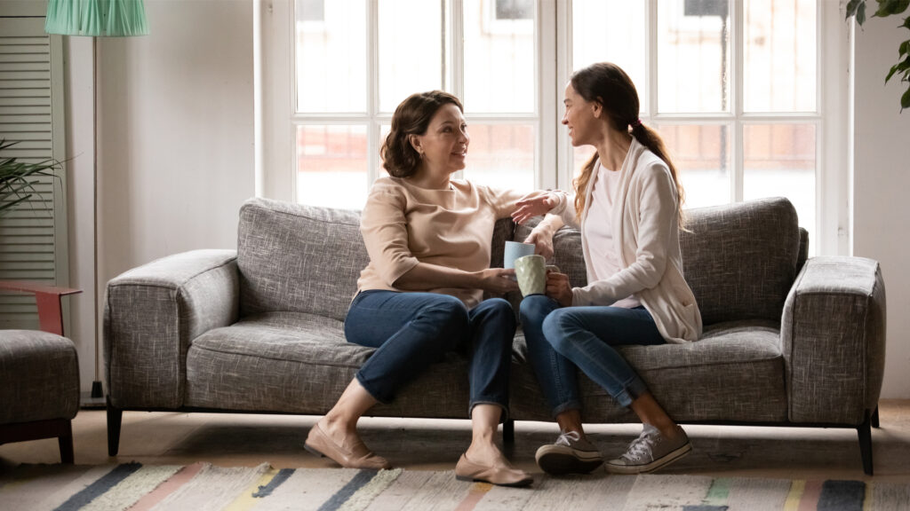 A mum talking to her adult daughter.